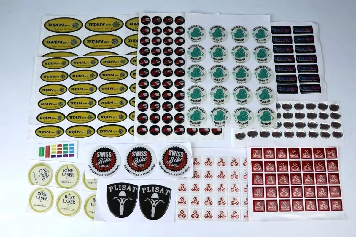 An assortment of printed labels arranged by design and shape.