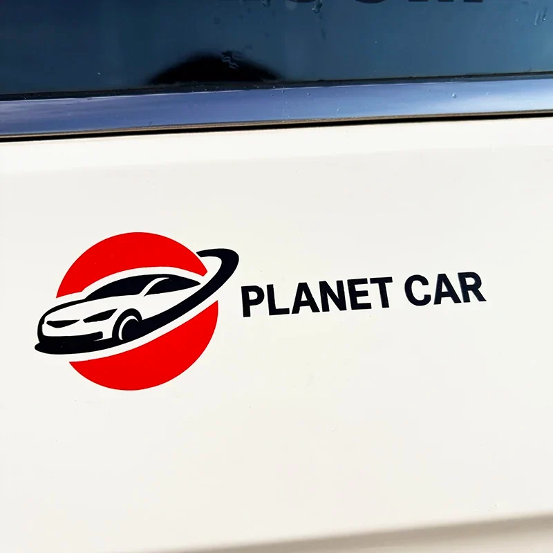 A red and black vehicle logo decal applied to a white car panel.