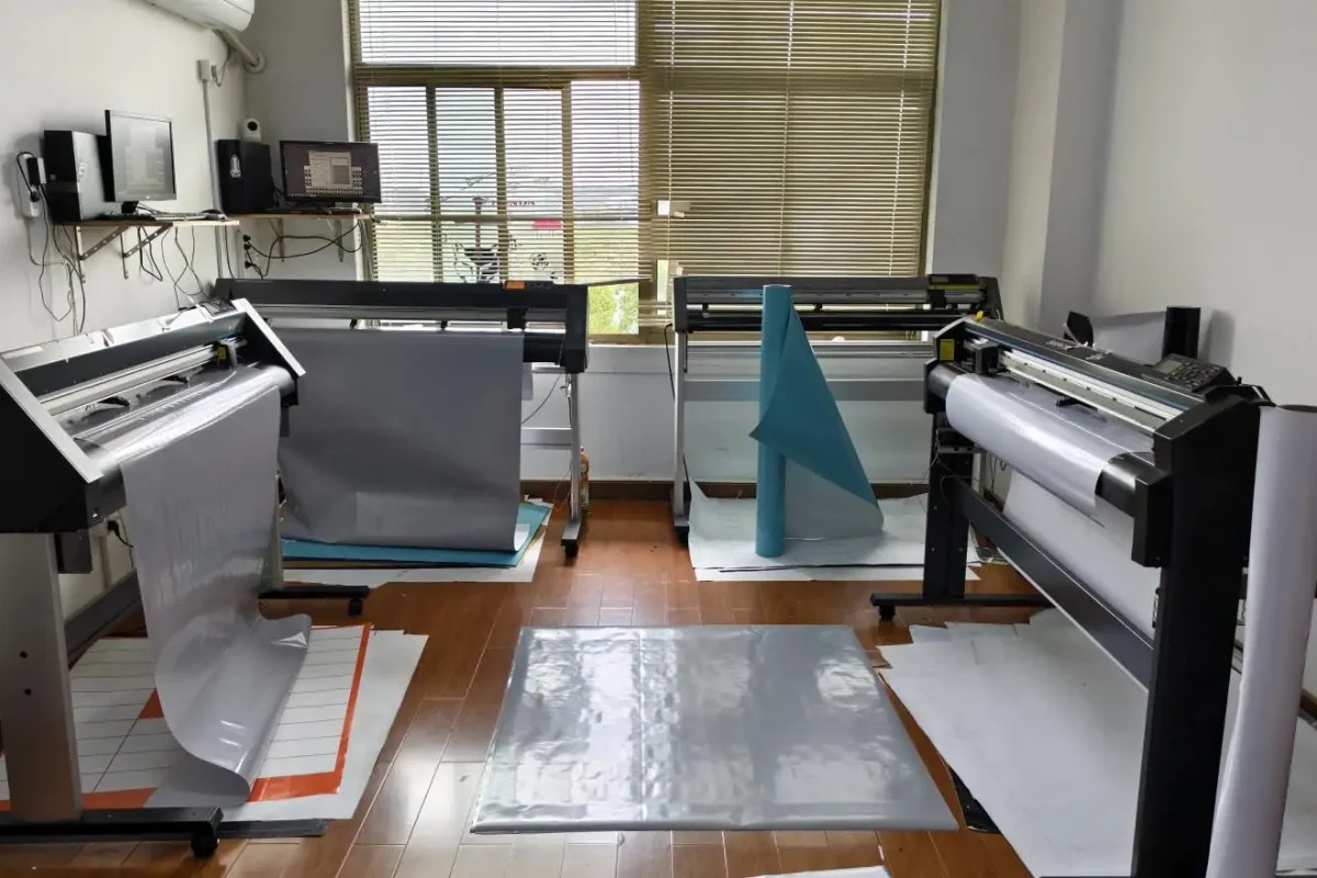 Wide-format cutting equipment with sheets of film.