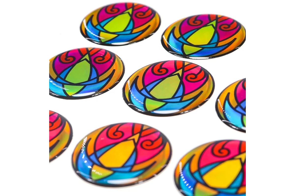 Colorful circular epoxy stickers showing raised glossy edges.