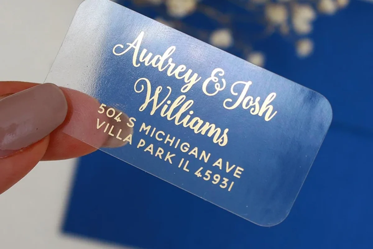 Fine gold lettering printed on a clear label