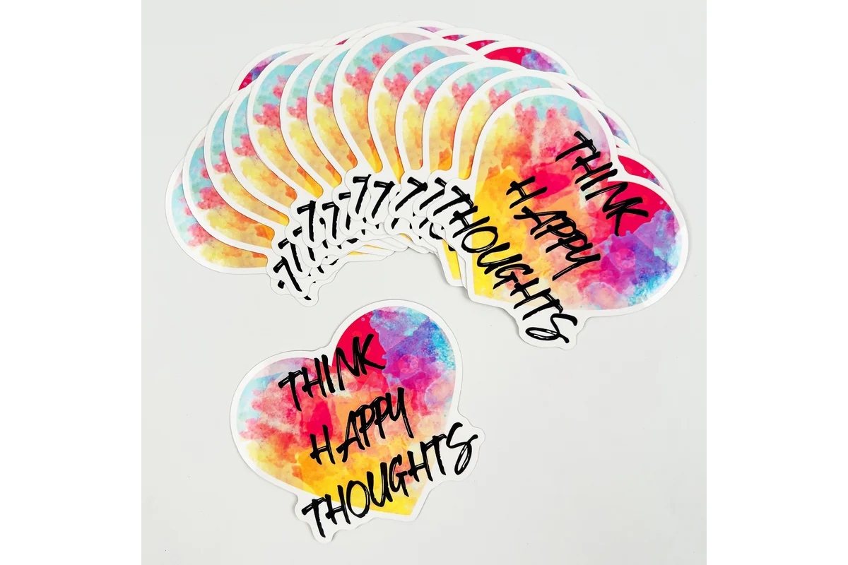Printed lettering on a fan of rainbow-reflective stickers
