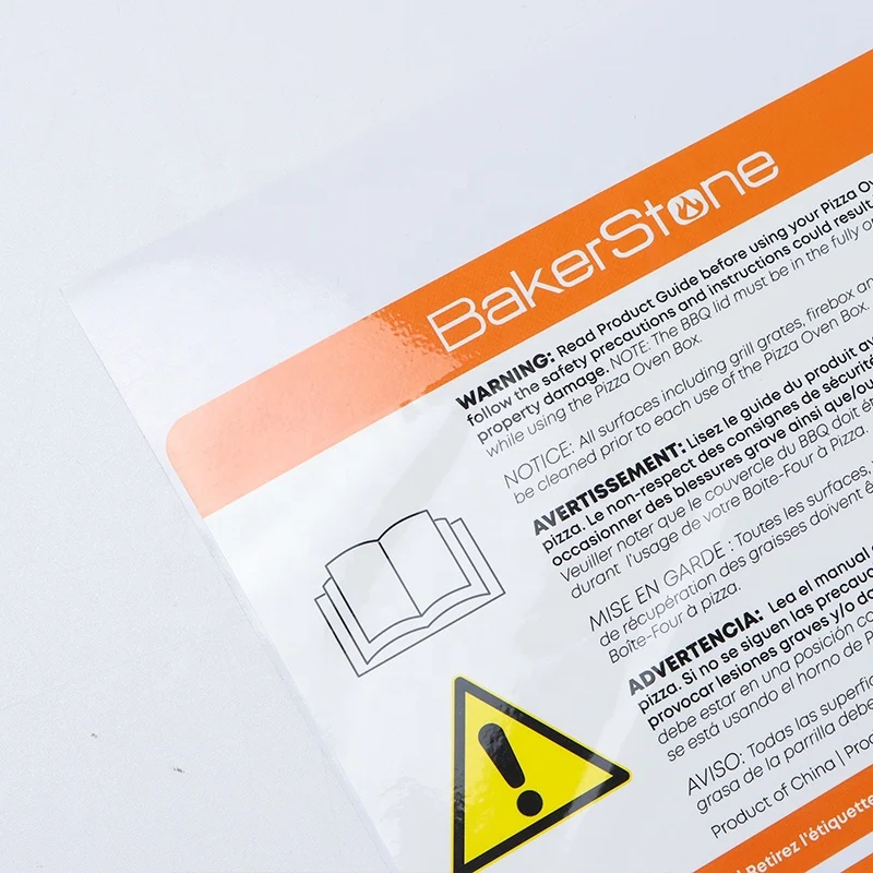A printed equipment warning label with an orange header and safety symbol