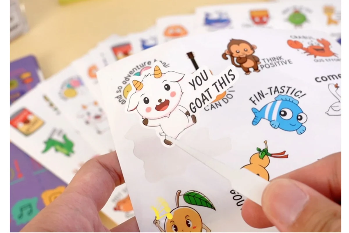 A small sticker being lifted from its backing sheet