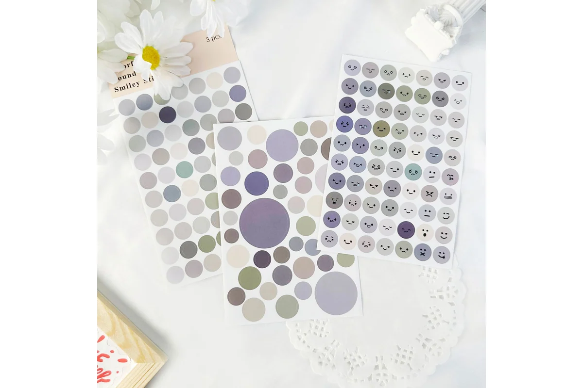 Printed circle sticker sheets laid out together.