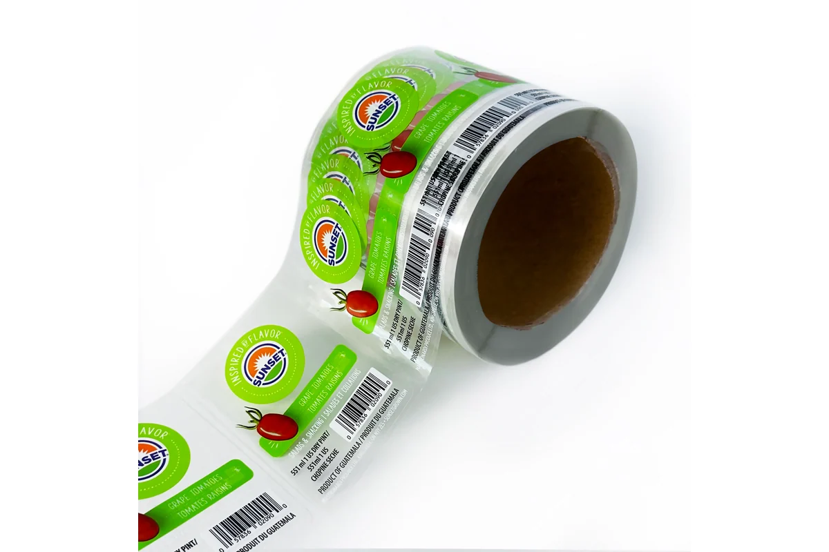 A roll of green printed labels with the backing strip extended.