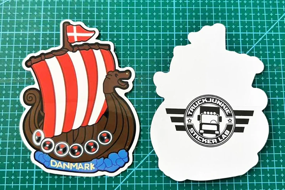 Front and back of a custom-shaped printed sticker sample