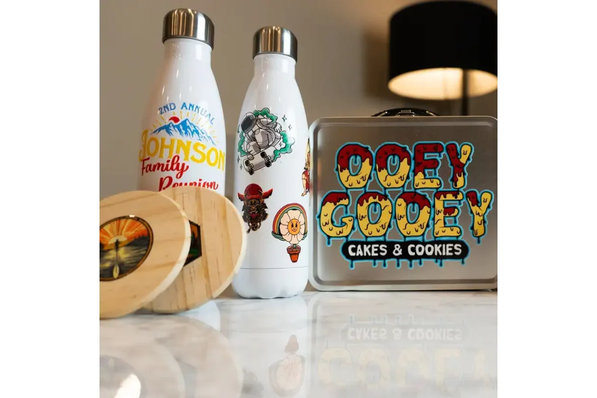 Printed illustrations decorating bottles, a metal tin and a wooden lid.