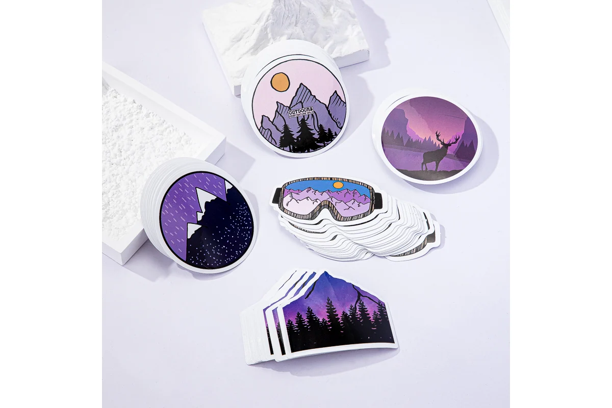 An assortment of outdoor themed stickers with purple and green designs.